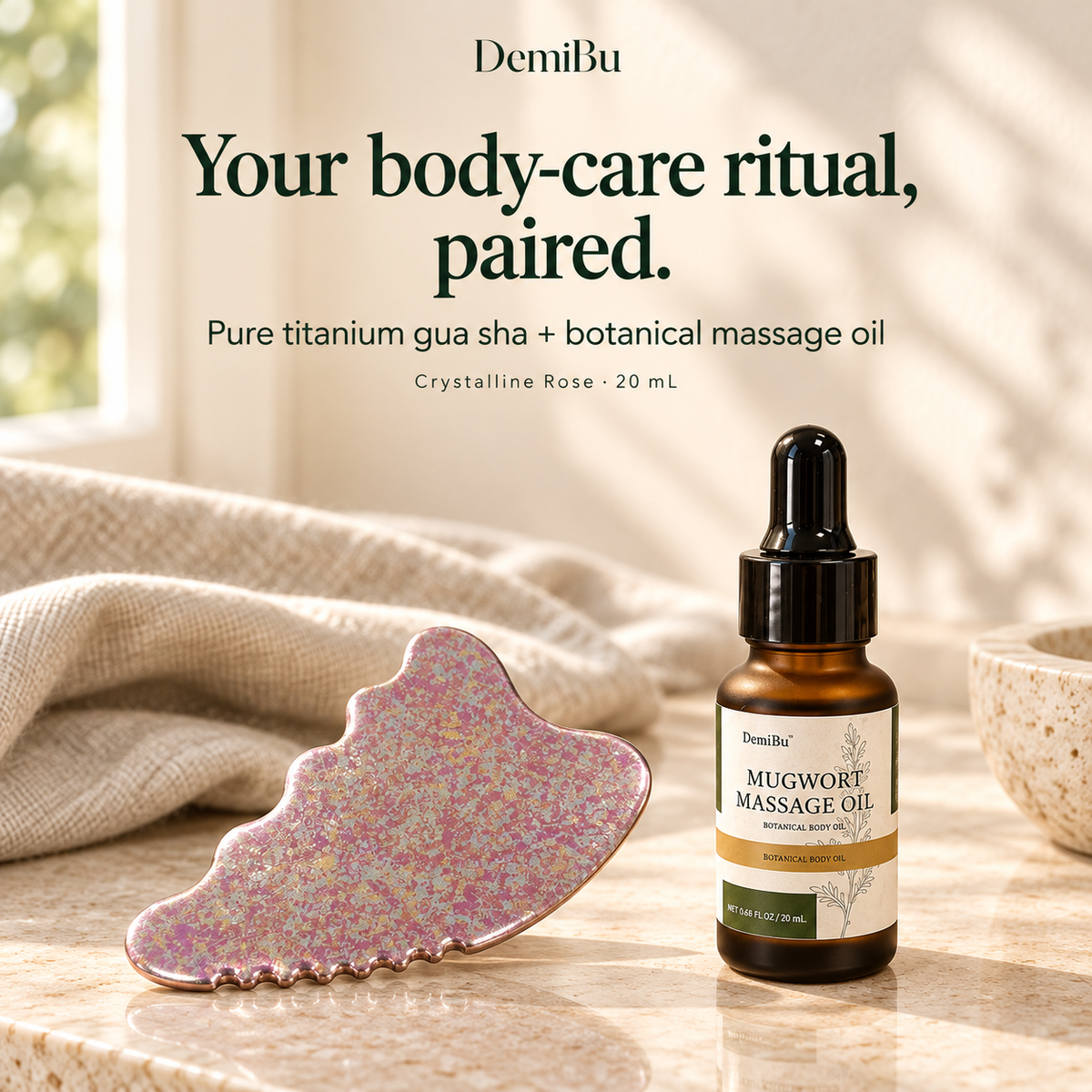 DemiBu Crystalline Rose titanium gua sha paired with the 20 mL Botanical Massage Oil in a cream-toned product scene
