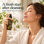 An adult with closed eyes spraying DemiBu Mugwort Hydrosol toward the face after cleansing