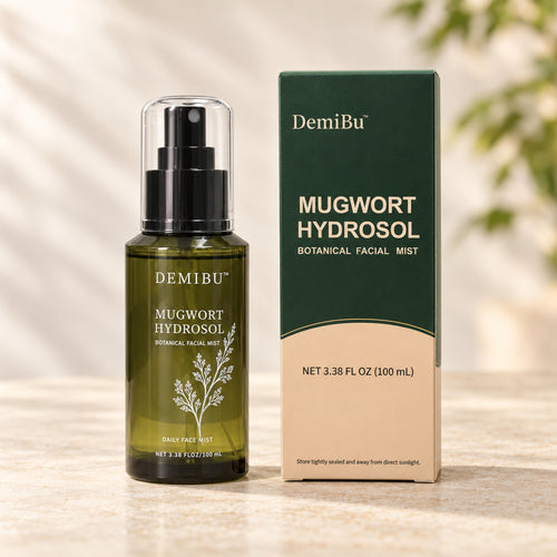 DemiBu mugwort hydrosol bottle and carton in soft daylight.