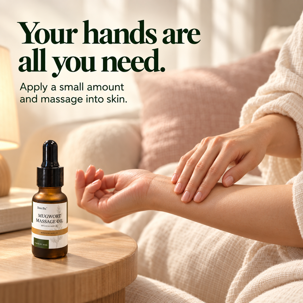 An adult massaging their forearm in an evening setting, with a 20 mL DemiBu Mugwort Massage Oil bottle nearby.