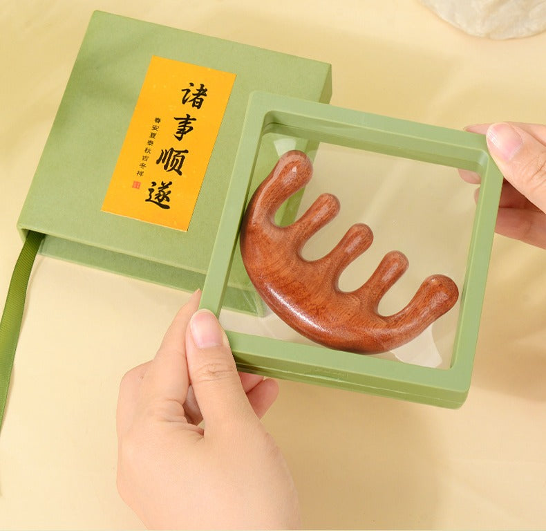 Opening the mint gift box of a five-tooth wooden scalp comb
