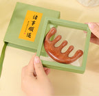 Opening the mint gift box of a five-tooth wooden scalp comb